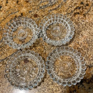 FOUR vintage scalloped candle stick holders